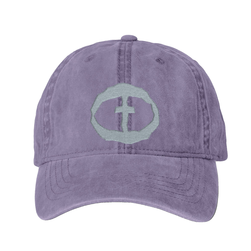 Front view of the violet Cassie Women's Ponytail Cap with a light-gray embroidered circular cross logo, product shot on white.