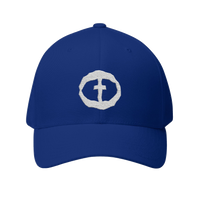 Front view of the royal blue Flexfit Men's Cap with a white circular cross logo on the front, product shot on white.