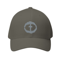 Front view of the olive Flexfit Men's Cap with a light-gray circular cross logo on the front, product shot on white.