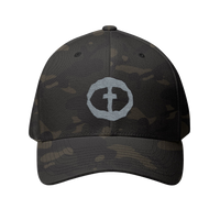 Front view of the multicam black Flexfit Men's Cap with a light-gray circular cross logo on the front, product shot on white.