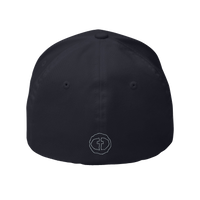 Back view of the dark navy Flexfit Men's Cap with a small outlined light-gray circular cross logo at the nape, product shot on white.