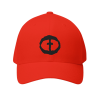 Front view of the red Flexfit Men's Cap with a black circular cross logo on the front, product shot on white.