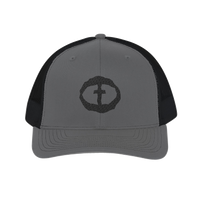 Front view of the charcoal-and-black Richardson 112 Cap with a black circular cross logo on the front panel, product shot on white.