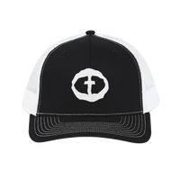 Front view of the black-and-white Richardson 112 Cap with a white circular cross logo on the front panel, product shot on white.