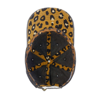 Interior view of the black Cassie Women's Ponytail Cap showing the leopard-print underbrim and seam tape, product shot on white.