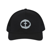 Front view of the solid black Richardson 112 Cap with a light-gray circular cross logo on the front panel, product shot on white.