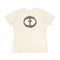 Front view of the natural Women's Rock and Salvation Tee with a large gray rock-textured circular cross logo on the chest, ghost-mannequin on white.