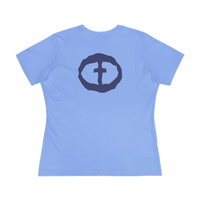 Front view of the Carolina blue Women's Rock and Salvation Tee with a large dark-gray rock-textured circular cross logo on the chest, ghost-mannequin on white.