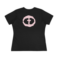 Front view of the black Women's Pink Rock and Salvation Tee with a large light-pink distressed circular cross logo on the chest, ghost-mannequin on white.