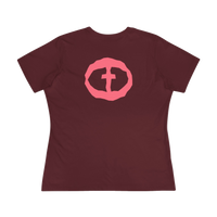 Front view of the maroon Women's Pink Rock and Salvation Tee with a large pink distressed circular cross logo on the chest, ghost-mannequin on white.