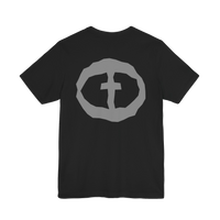 Front view of the black Men's Rock and Salvation Lightweight Tee with a large gray rock-textured circular cross logo on the chest, ghost-mannequin on white.
