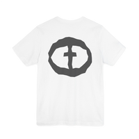 Front view of the white Men's Rock and Salvation Lightweight Tee with a large gray rock-textured circular cross logo on the chest, ghost-mannequin on white.